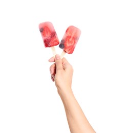 Woman holding berry popsicles on white background, closeup