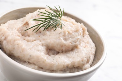 Photo of Delicious lard spread in bowl on white background, closeup