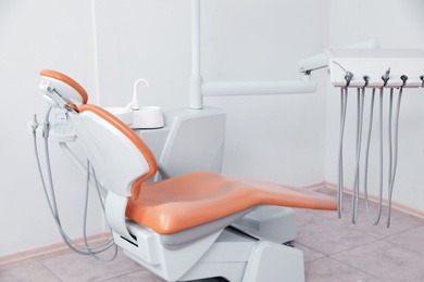 Dentist's office with modern chair and professional equipment