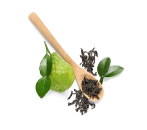 Dry bergamot tea leaves, wooden spoon and fresh fruit on white background, top view