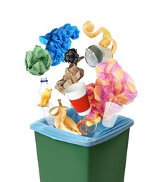 Different garbage falling into trash bin with rubbish bag on white background