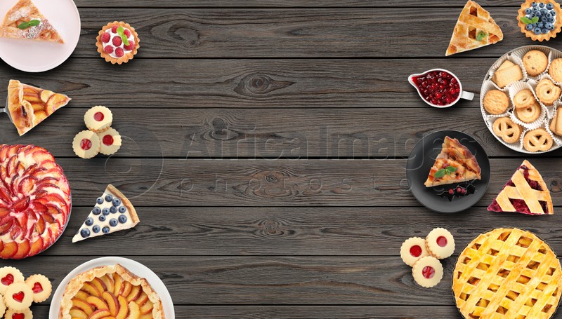 Many different delicious pies on wooden table, flat lay. Space for text 