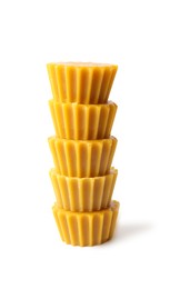 Photo of Stack of natural beeswax cake blocks on white background