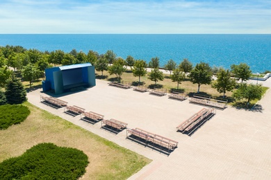 Outdoor cinema and entertainment place near sea on sunny day 