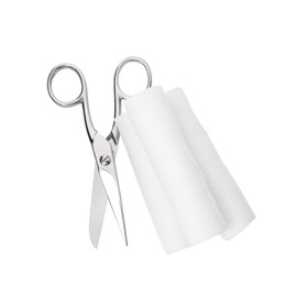 Medical bandage rolls and scissors on white background, top view