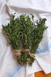 Photo of Bunches of wilted mint on table, top view