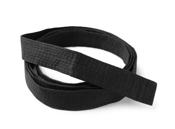 Rolled black belt on white background. Oriental martial arts