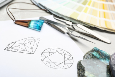 Drawing of gemstones on table, closeup. Designer's workplace