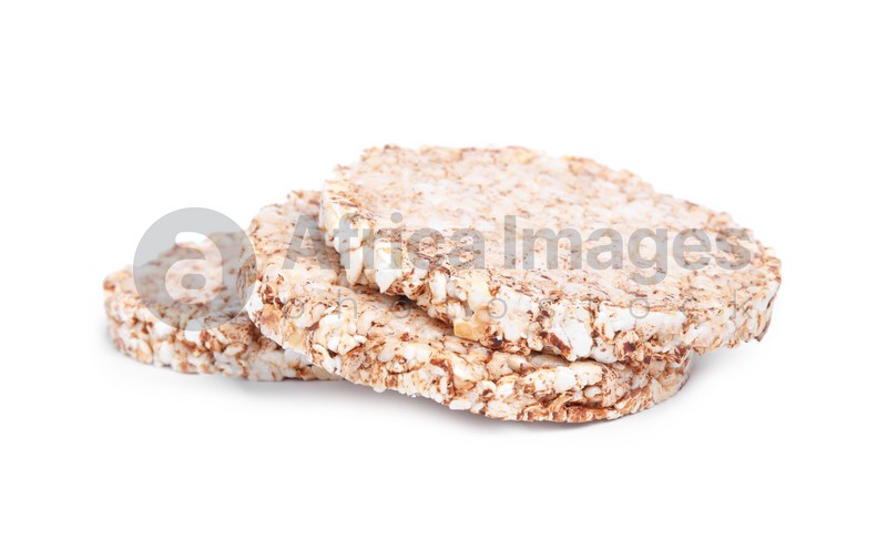 Tasty crunchy buckwheat cakes on white background