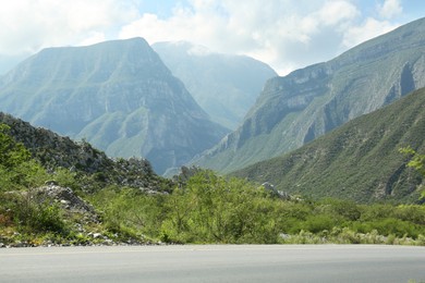 Picturesque view of mountains and plants near road