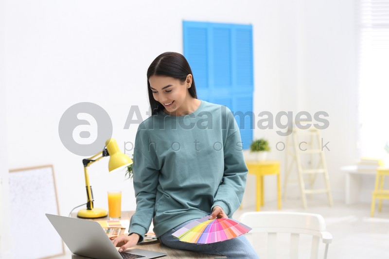 Female designer working in office. Creative profession