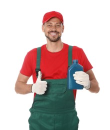 Man holding blue container and showing thumbs up of motor oil on white background