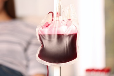 Blood donation pack hanging on dropper stand at hospital