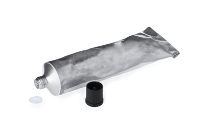 Blank tube of glue and cap on white background