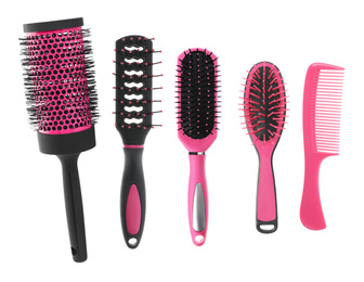 Set with different hair brushes and comb on white background