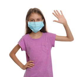 Little girl in protective mask showing hello gesture on white background. Keeping social distance during coronavirus pandemic