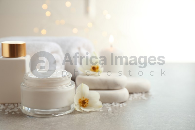Spa composition with skin care products on light background, space for text