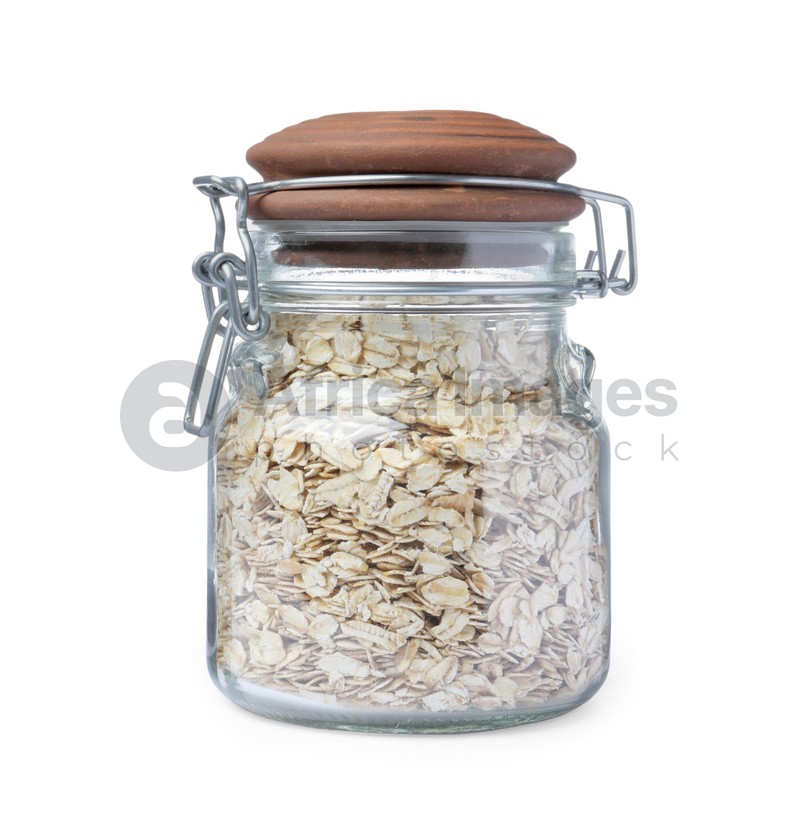 Raw oatmeal in glass jar isolated on white