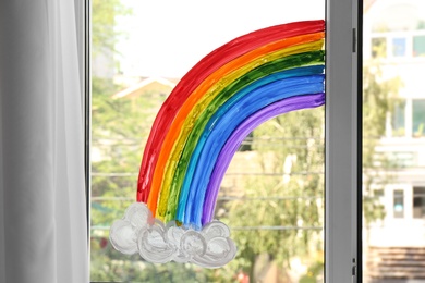 Picture of rainbow on window glass indoors. Stay at home concept