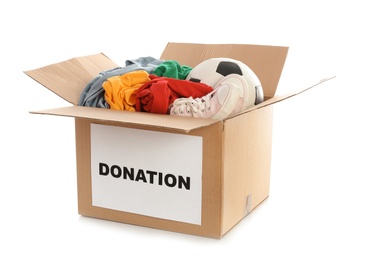 Carton box with donations on white background