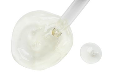 Photo of Dripping facial gel from pipette on white background, top view