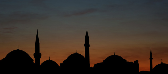 Silhouette of mosque during sunset, banner design. Muslim culture 