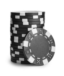 Black casino chips stacked on white background. Poker game