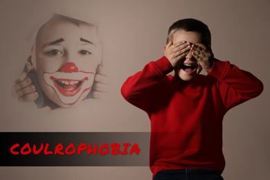 Coulrophobia concept. Scared little boy and phantom of clown