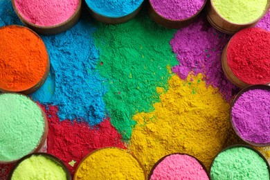 Colorful powder dyes as background, top view. Holi festival