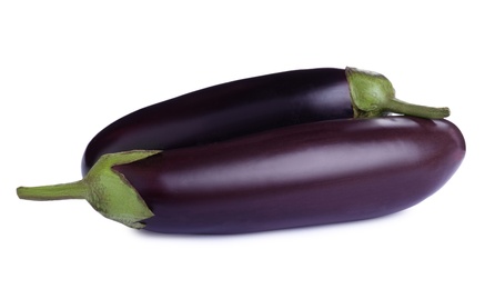 Organic fresh ripe eggplants on white background
