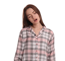 Young woman wearing pajamas in sleepwalking state on white background