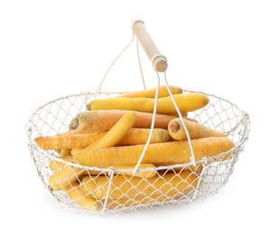 Raw yellow carrots in metal basket isolated on white