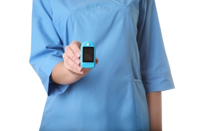 Female doctor holding heart rate monitor on white background, closeup. Medical object