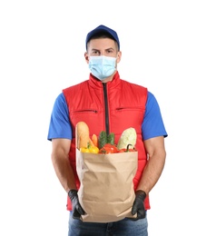 Courier in medical mask holding paper bag with food on white background. Delivery service during quarantine due to Covid-19 outbreak