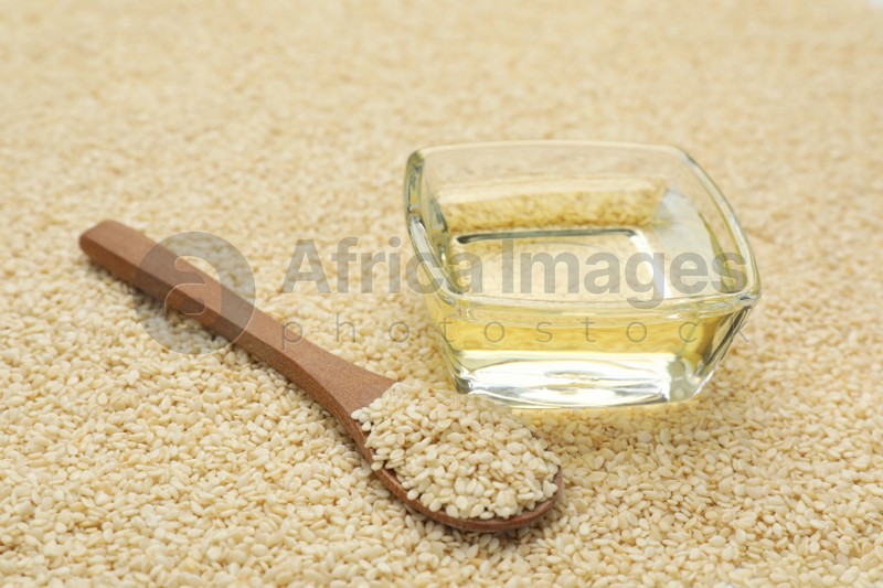 Bowl of fresh sesame oil and spoon on seeds