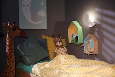 Crescent shaped night lamp on wall in child's room