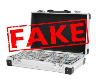 Open metal case full of fake money on white background