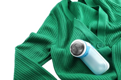 Photo of Modern fabric shaver and woolen cardigan on white background, above view