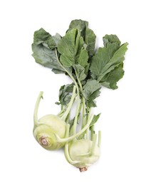 Photo of Whole ripe kohlrabies with leaves on white background, top view
