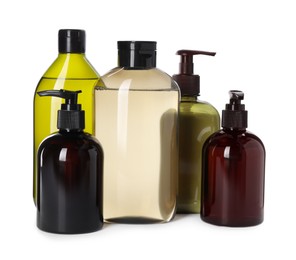 Different bottles of shampoo on white background