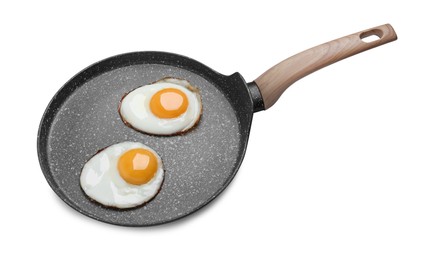 Frying pan with delicious fried eggs isolated on white