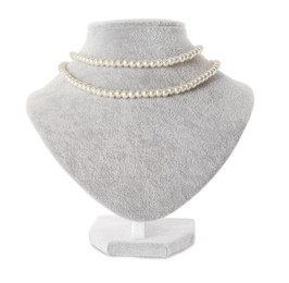 Stylish pearl necklace on jewelry bust against white background