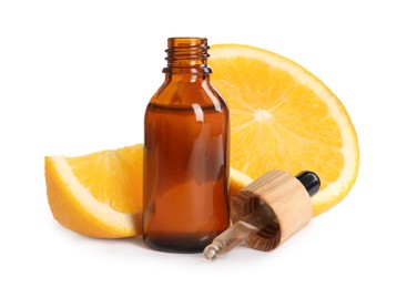 Bottle of citrus essential oil, pipette and fresh orange on white background