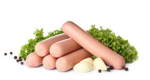 Raw vegetarian sausages with garlic and lettuce on white background
