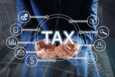 Tax concept. Man demonstrating scheme with icons
