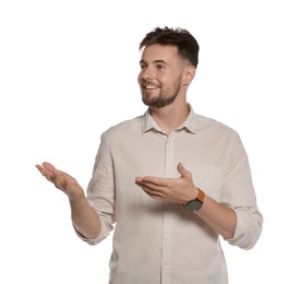 Handsome young man gesturing on white background