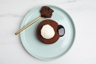 Delicious fresh fondant with hot chocolate and ice cream on white marble table, top view