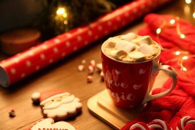 Tasty hot drink with marshmallows, space for text. Christmas atmosphere