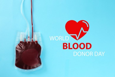 World Donor Day. Blood pack on light blue background, top view