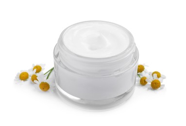 Jar of body cream with camomile flowers on white background